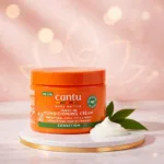 Cantu Shea Butter Leave-In Conditioning Cream jar displayed in a premium studio product image for natural curls, coils, and waves